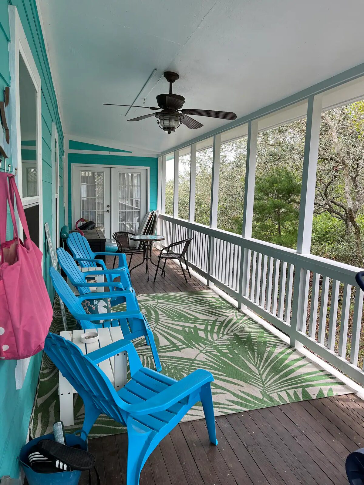 Southern-facing porch with Adirondack chairs